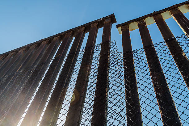 Section of Border Fence Separating the US and Mexico stock photo