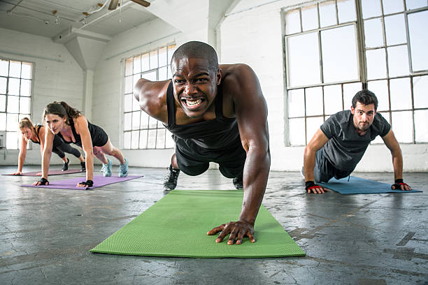 istock Trainer gym class group gym challenge gritting teeth drive 617601806