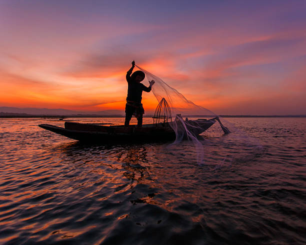 istock Silhouette of traditional fishermen 617601814