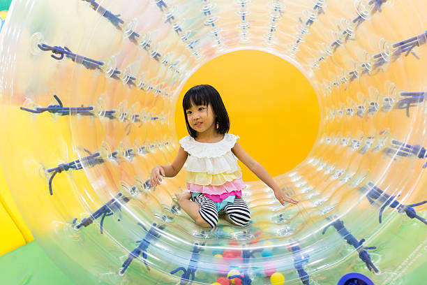 istock Asian Chinese Little Girl Playing Roller Wheel 617603868