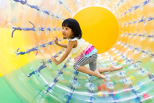 istock Asian Chinese Little Girl Playing Roller Wheel 617604220