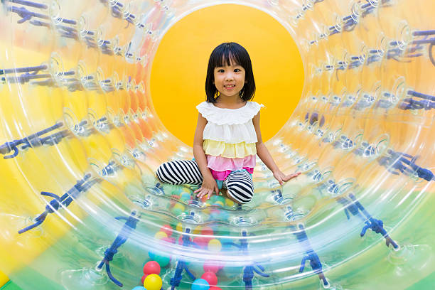 istock Asian Chinese Little Girl Playing Roller Wheel 617604266