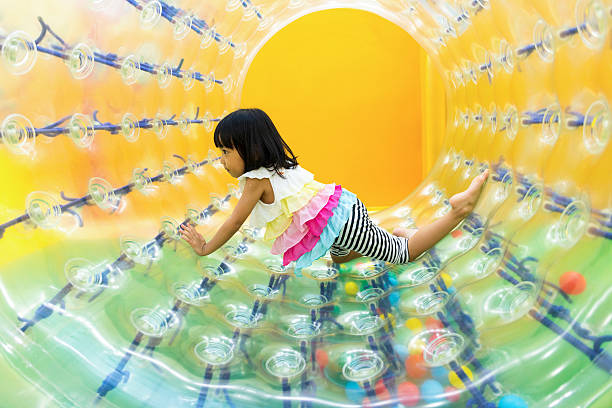 istock Asian Chinese Little Girl Playing Roller Wheel 617604530