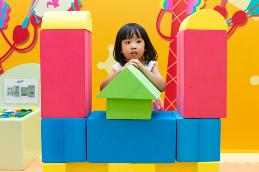 Asian Chinese Little Girl Playing Giant Blocks At Indoor Playground