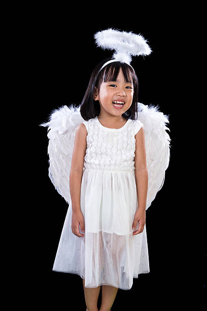 Charming sleeping little girl angel on soft white fur stand near arrow and arc, cupid, Valentines day concept, isolated on white background.