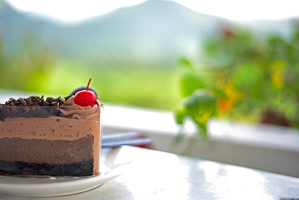 istock Delicious chocolate cake on plate on table 617734648