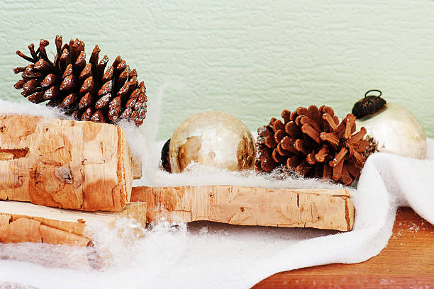 istock abstract composition from birch logs, Christmas balls and cones 617734986