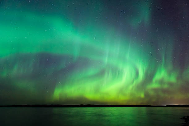 istock Northern lights over lake in Finland 617736176