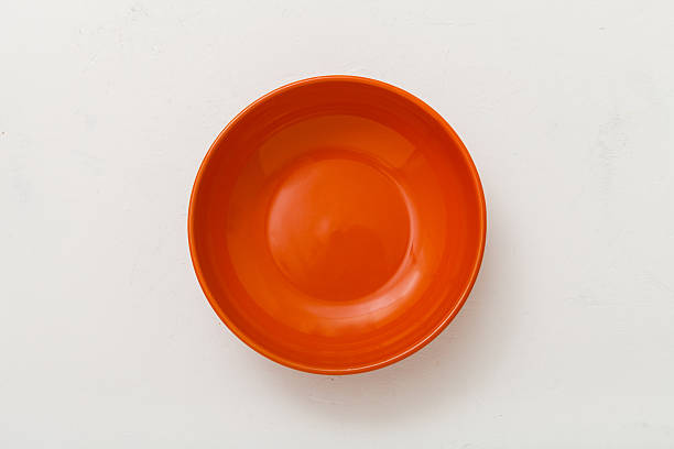 istock top view of orange bowl on plastering plate 617736540