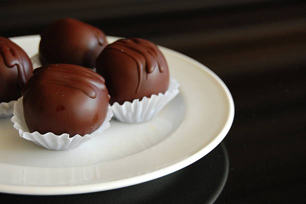 istock Healthy chocolate truffles with nuts and dates 617737498