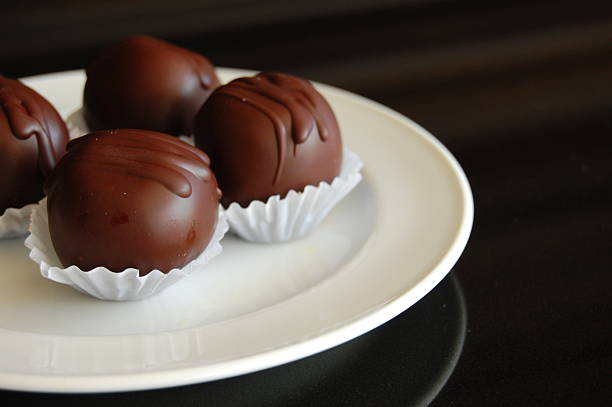 istock Healthy chocolate truffles with nuts and dates 617737534