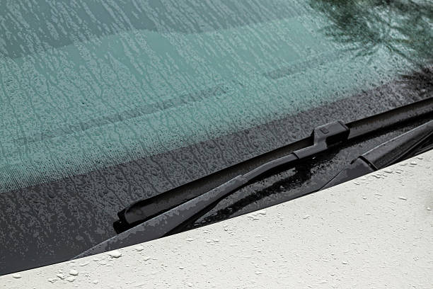 istock Windshield Bonett and Wiper Arm Covered in Water Droplets 617737736