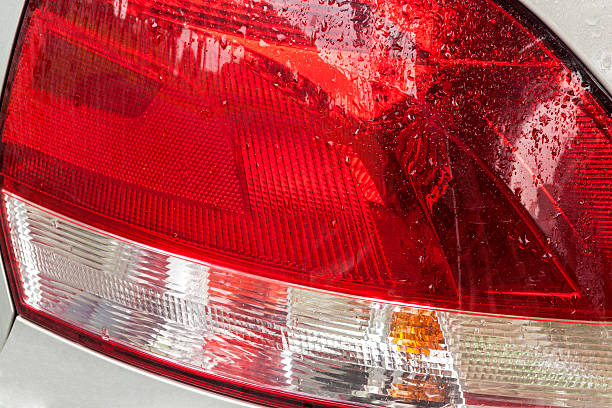 istock Wet Vehicle Rear Tail Lamp Colors Patterns and Textures 617739956