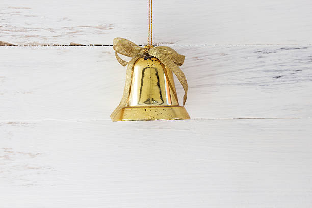 istock Christmas bell on wooden floors 617740956