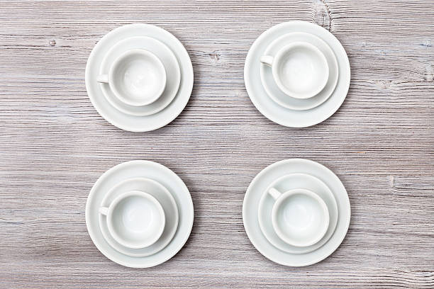 istock top view of four cups and saucers on gray table 617741432