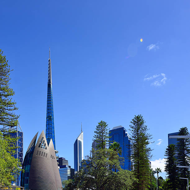 Perth skyscrapers and swan bell tower in blue sky, Western Australia.