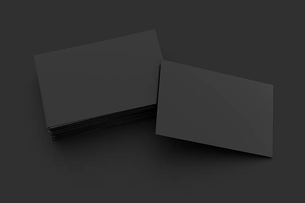 istock Blank black business cards on black background 617741746