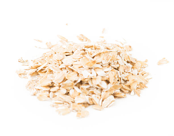 istock Bunch of oat flakes isolated on white background. 617743682