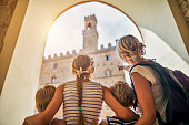 Family visiting italian town of Volterra, Tuscany