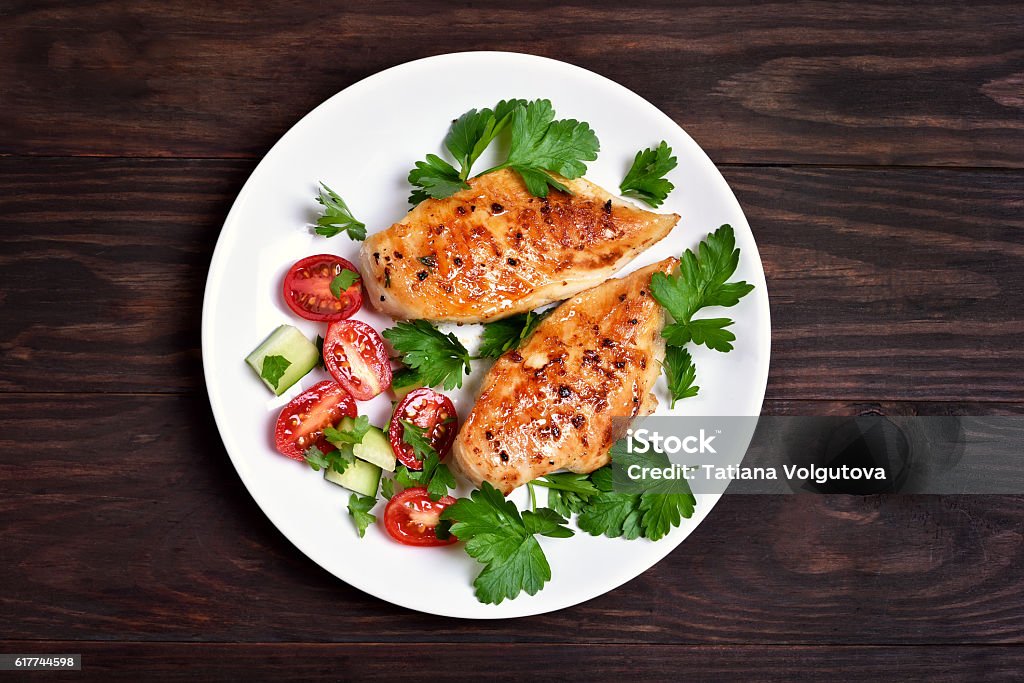 Grilled chicken breast Grilled chicken breast and vegetable salad, top view Chicken Breast Stock Photo