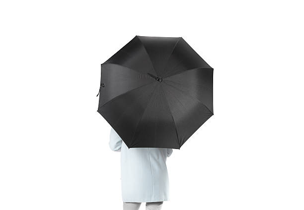 istock Women stand backwards with black blank umbrella opened mockup 617745070