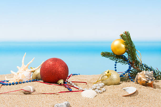 istock Christmas tree decorations on the beach in tropical. Concept of 617746450