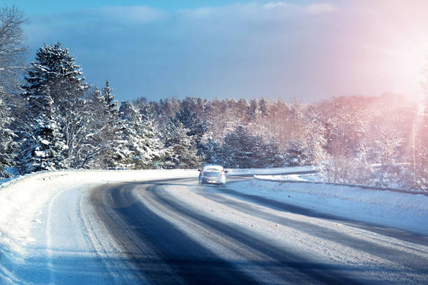 istock Car tires on winter road 617746902