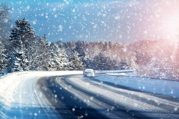 istock Car tires on winter road 617747344