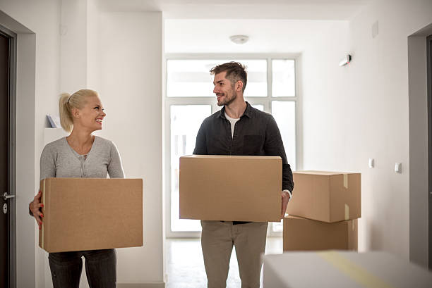 istock Couple moving into new building 617747358
