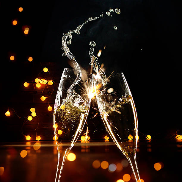 Champagne Glasses Infront Of Defocused Lights