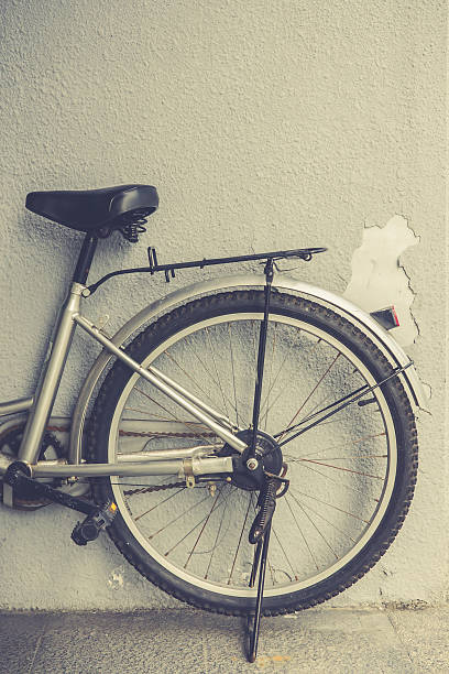 istock Bicycle parking in front of a peeling wall. 617752632