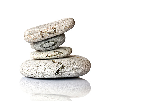 2017 written on stack of pebbles isolated on white background