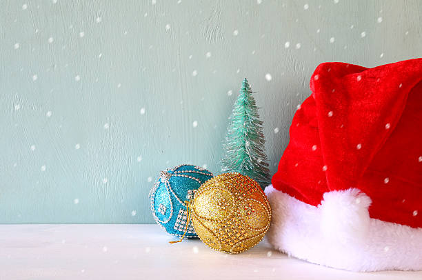istock Image of christmas trees next to santa hat. 617754214