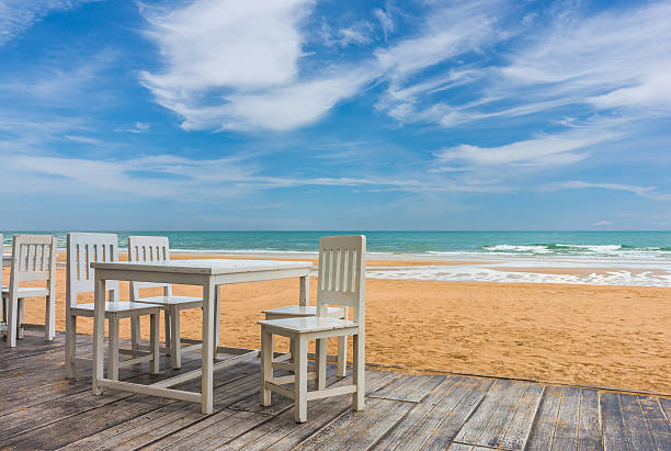 istock wood floor and seaside table with beach and sea background 617756464