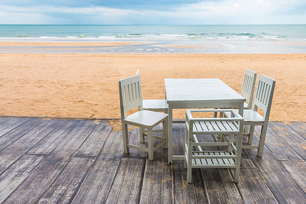 istock wood floor and seaside table with beach and sea background 617756674