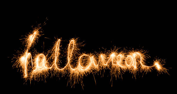istock Halloween sign sparklers on black background 617756788