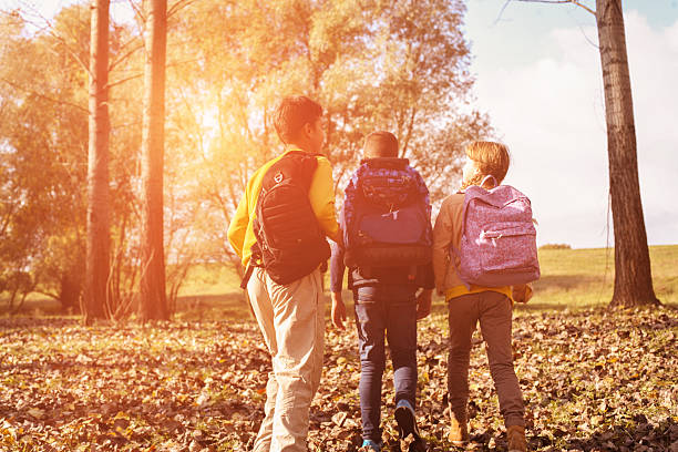 istock Small group of  children returning from school. 617758202