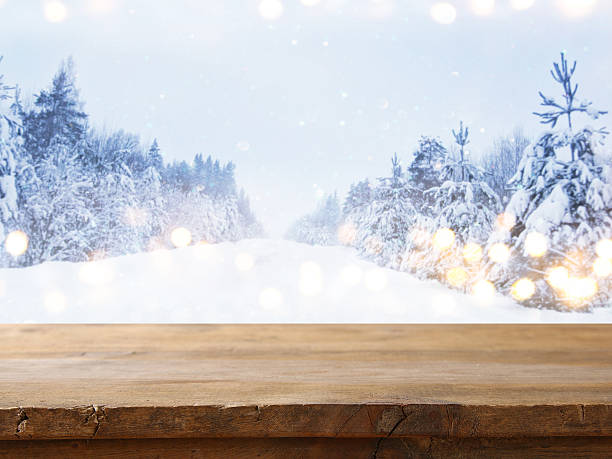 istock Empty wooden table in front of dreamy winter landscape 617758960