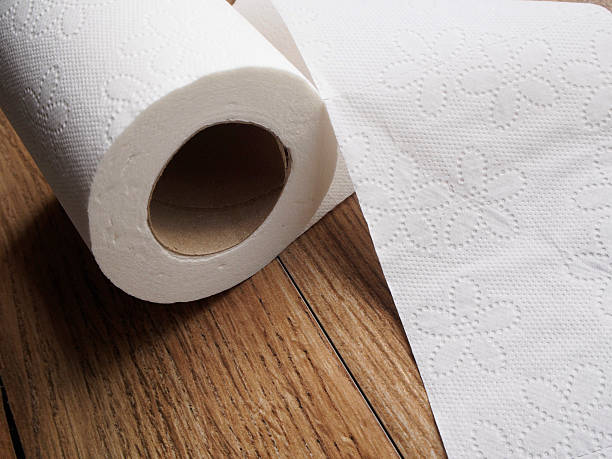 istock Paper toilet on wood background 617761430