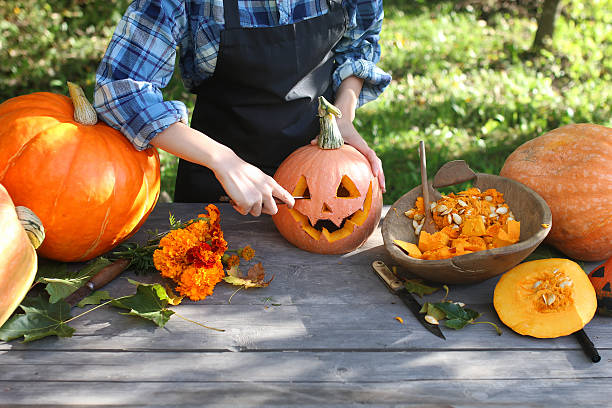 istock carve pumpkins for Halloween 617762844