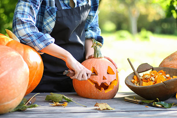 istock carve pumpkins for Halloween 617763076