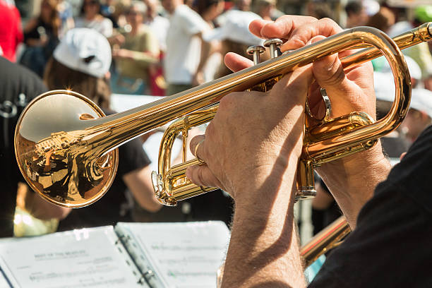 istock Man Playng Brass Lacquered Trumpet 617763112