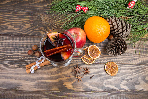 istock Hot mulled wine with spices, orange, apple. Christmas decorations 617763558