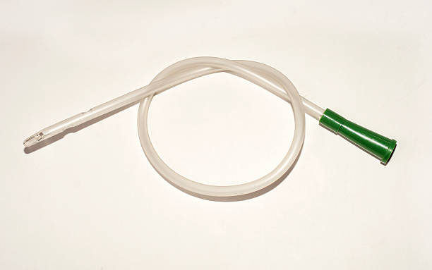 Urinary catheter an intermittent transparent catheter isolated over a white backgroundUrinary catheter tracheotomy tubing stock pictures, royalty-free photos & images