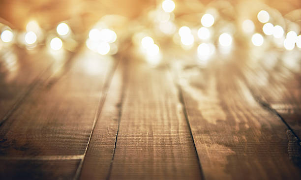 istock lights on wooden rustic background 617764386