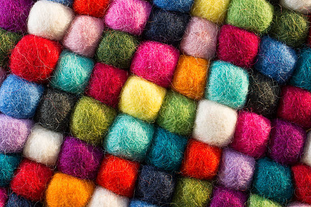 istock Geometric background with balls of colored synthetic wool 617765542