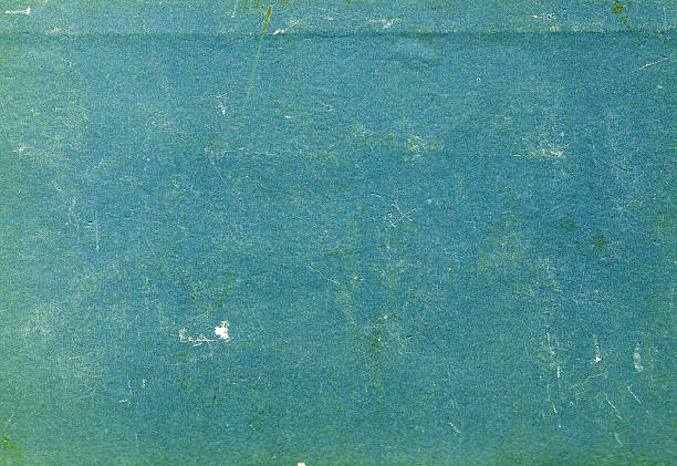 istock cyan color scratched paper texture. 617766314