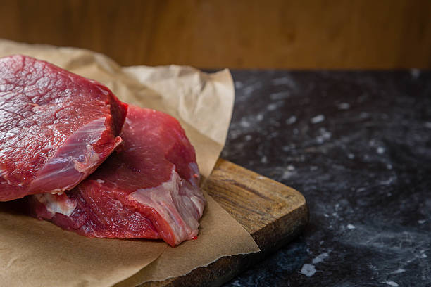 istock Raw beef meat with herbs and spices 617766488