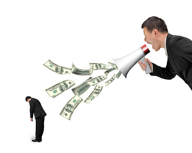 istock Boss using megaphone yelling at employee spraying out dollar bil 617767006