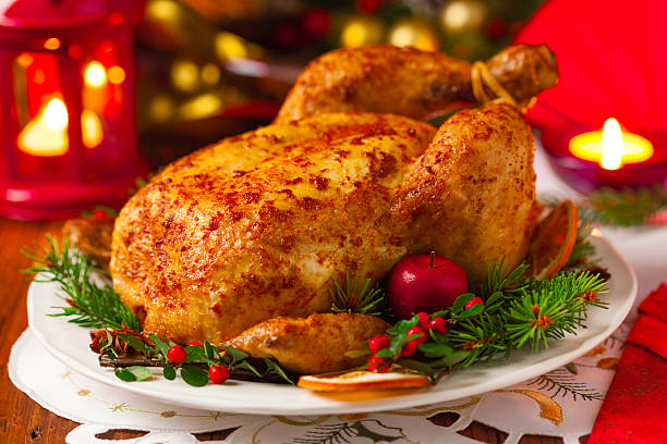 istock Roasted whole chicken with Christmas decoration. 617767770